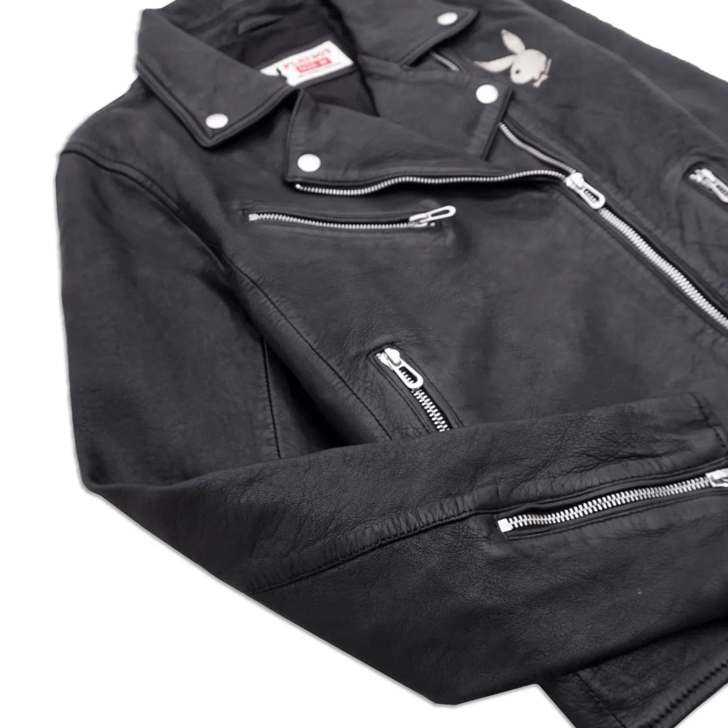 Black women's leather biker jacket with silver zippers and embroidered rabbit logo on chest