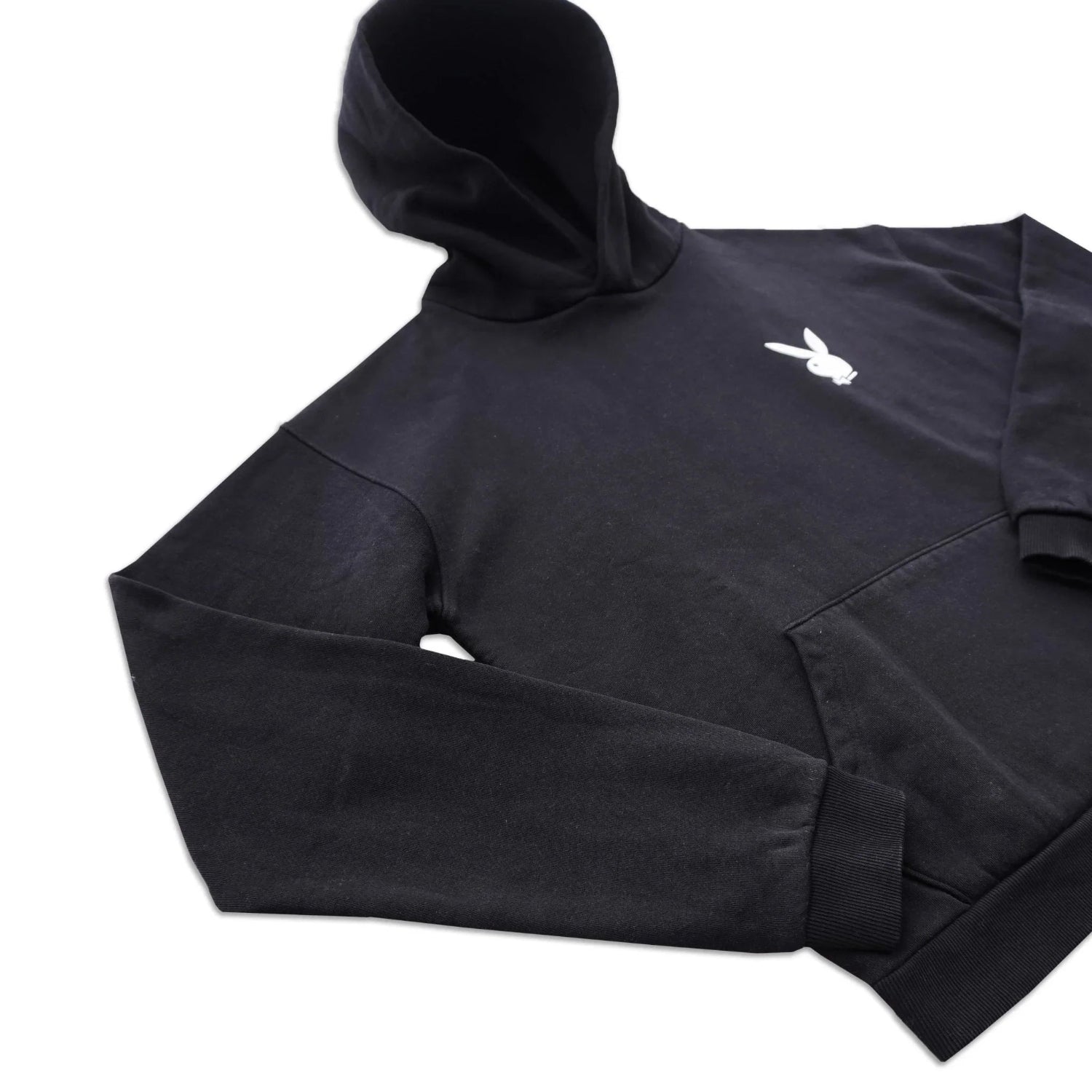 Black hoodie with white bunny logo on chest and front kangaroo pocket, flat lay view