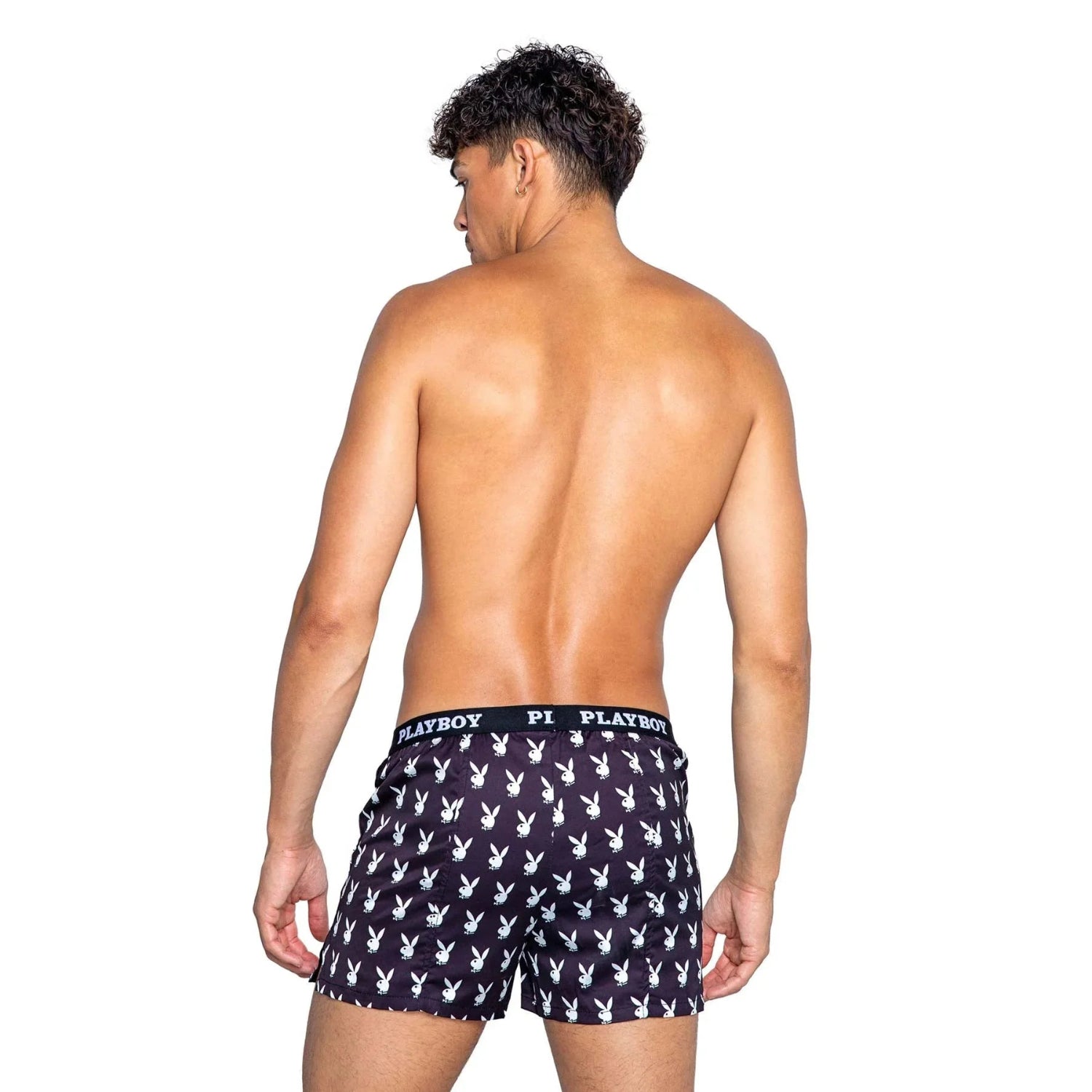 Back view of a man modeling black men's boxer shorts with white bunny logo print on white background