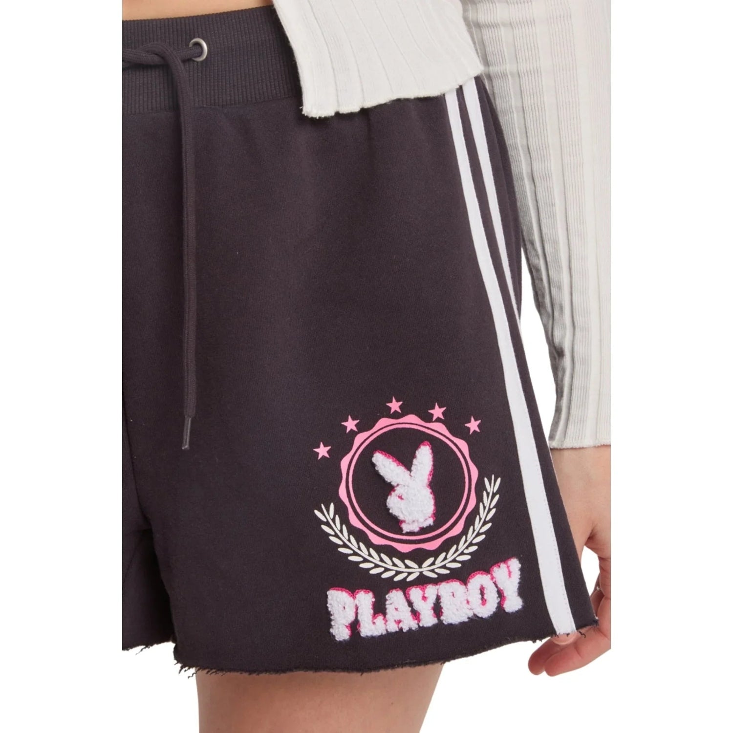 Black varsity shorts with pink bunny logo, white stripes, and star embroidery detail