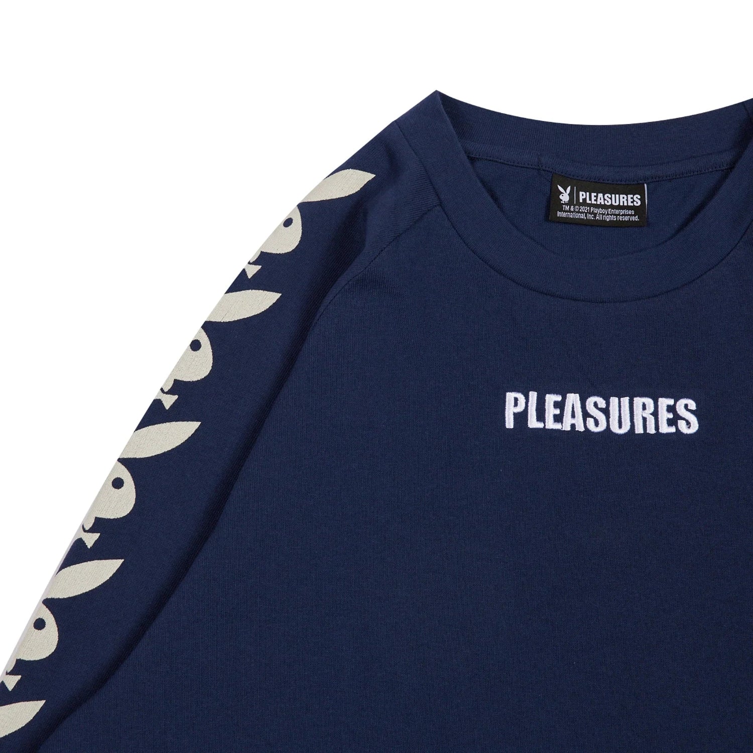 Navy blue raglan long sleeve t-shirt with white Pleasures text and bunny head graphics on sleeve