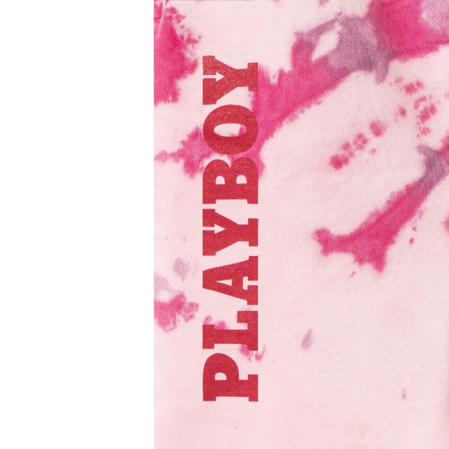 Pink tie-dye shorts with bold red 'PLAYBOY' text and vibrant pattern detail