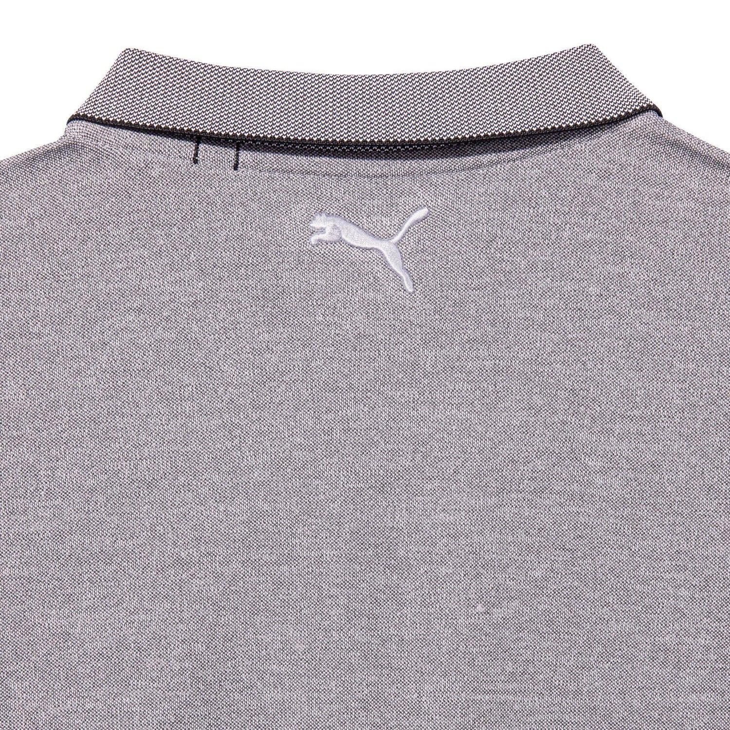Close-up of grey pique performance polo shirt with tipped collar and embroidered logo on back