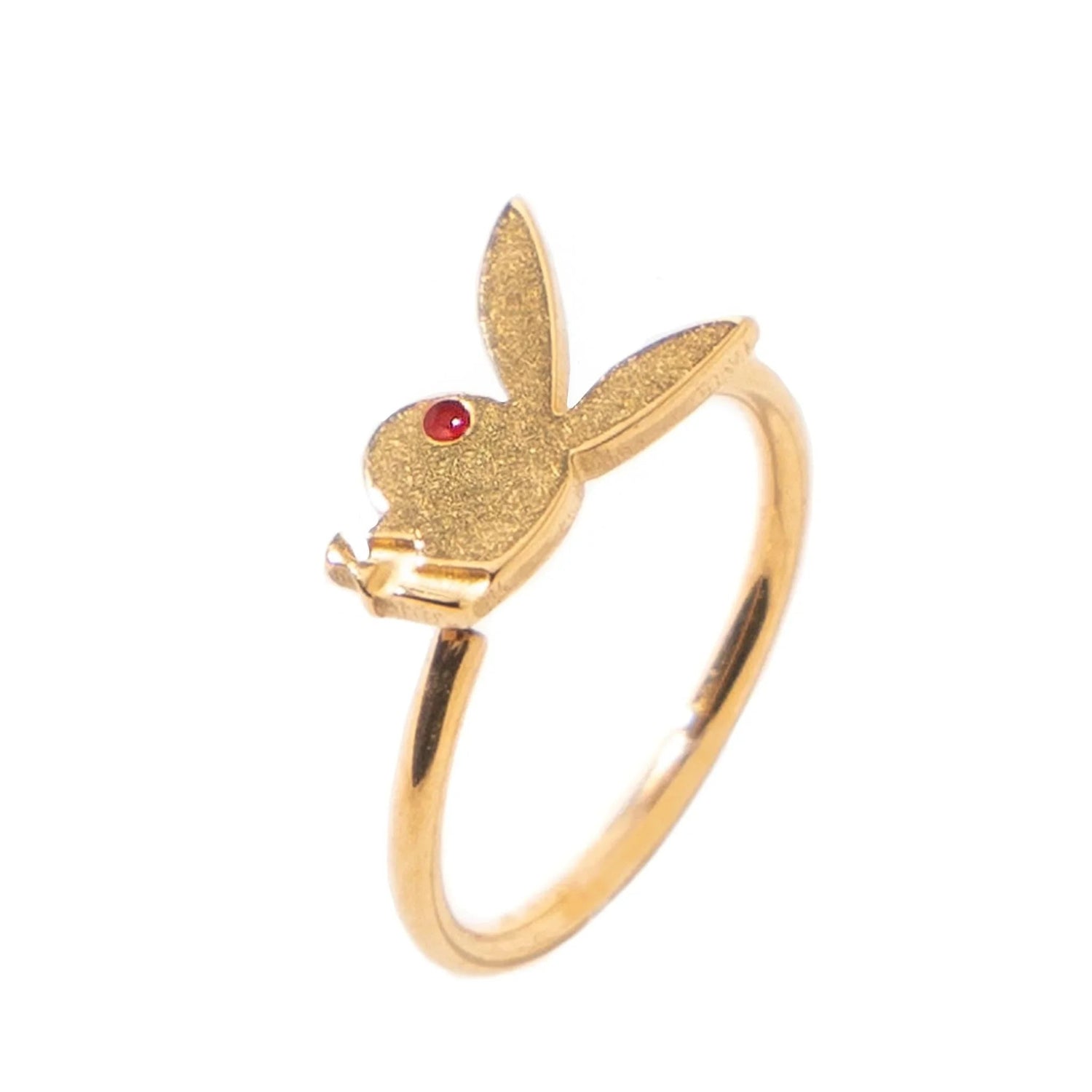 Gold-tone ring featuring a rabbit head design with a red gemstone eye on white background.