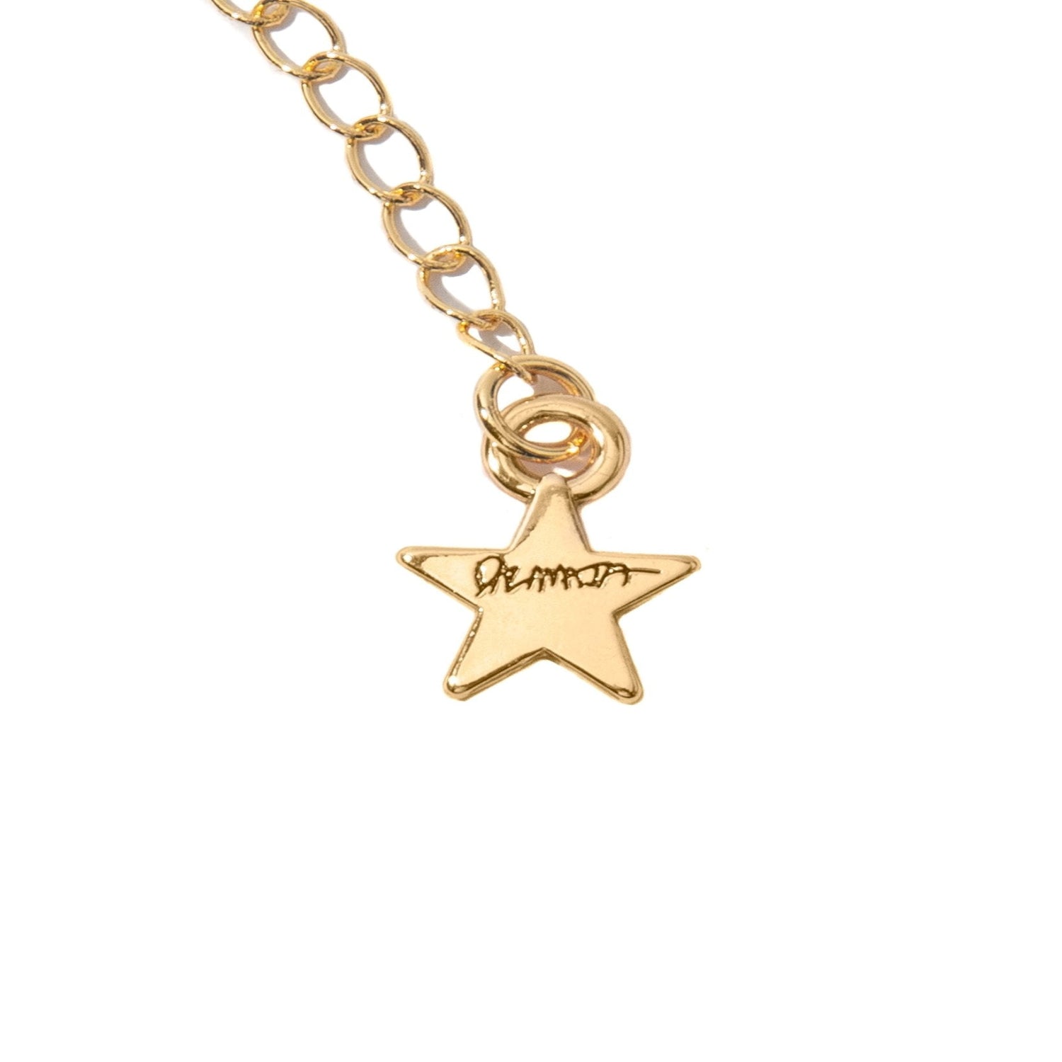 Gold chain necklace with a small star pendant featuring engraved text on white background