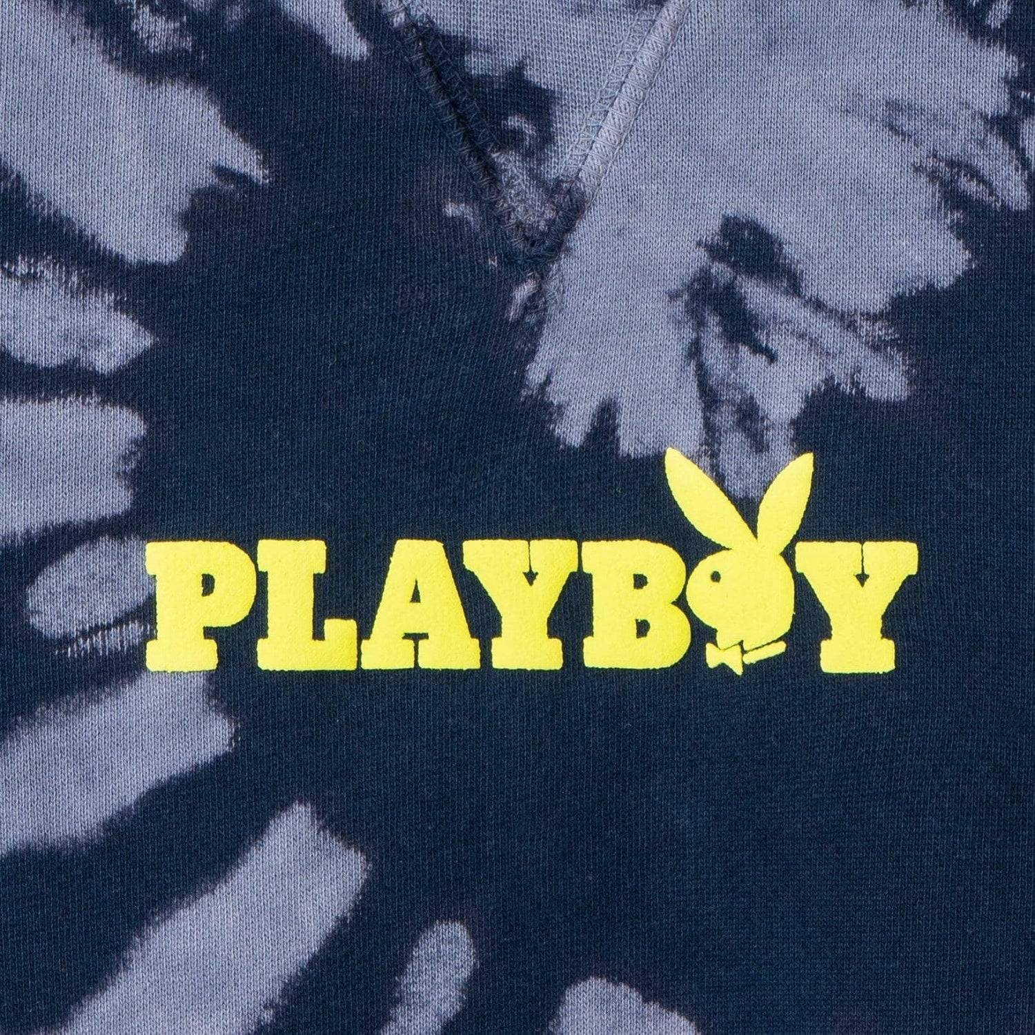 Navy blue tie-dye sweatshirt with yellow PLAYBOY logo and bunny graphic on chest