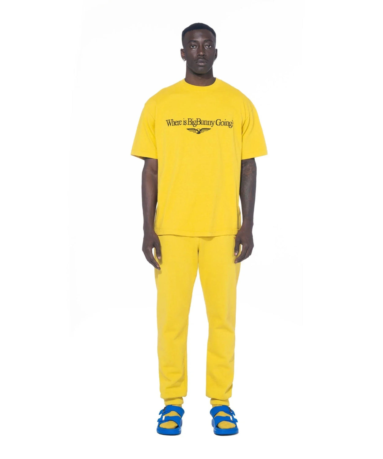 Man wearing yellow 'Where is Big Bunny Going' graphic t-shirt and yellow pants