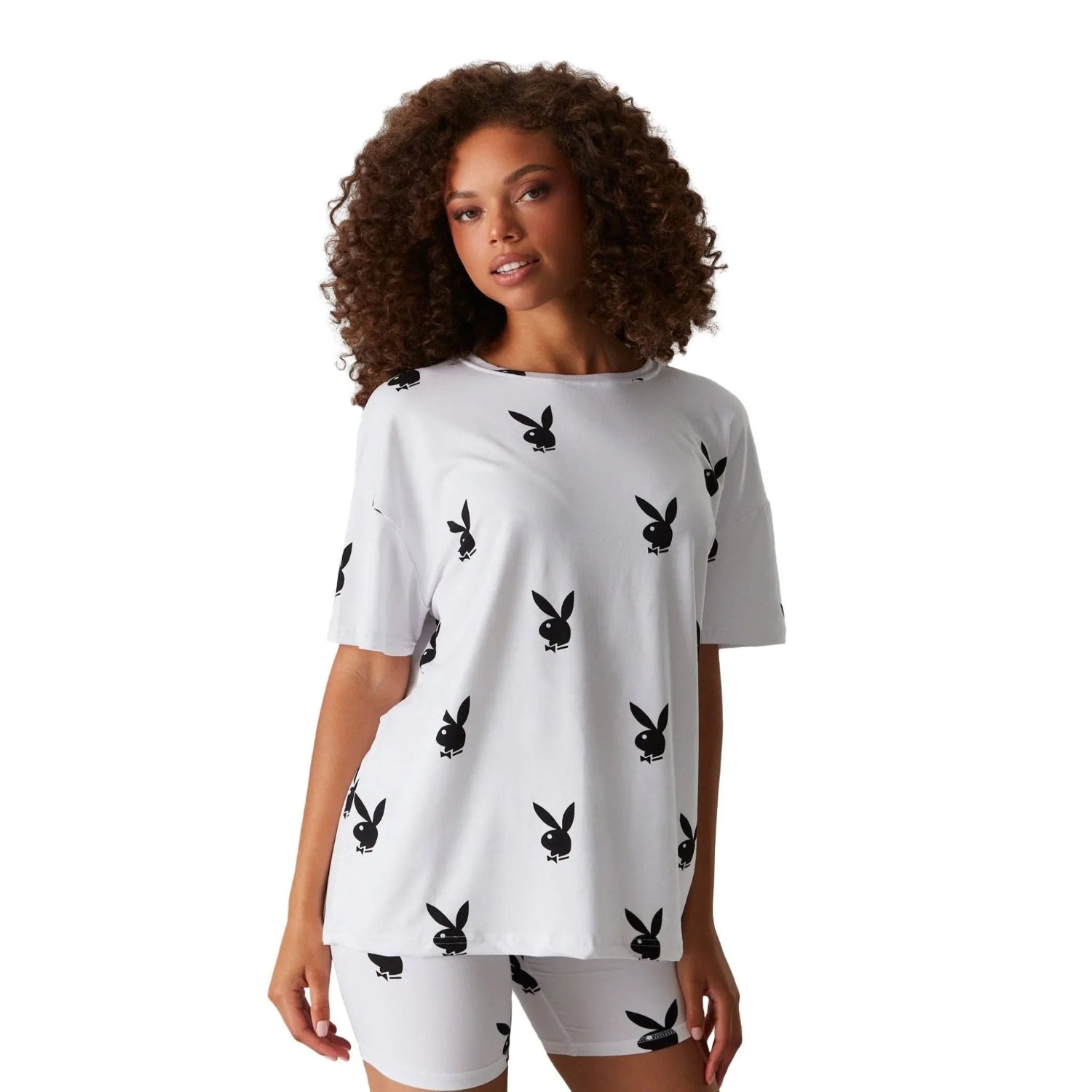 Woman wearing white t-shirt and shorts with black bunny print, casual loungewear set