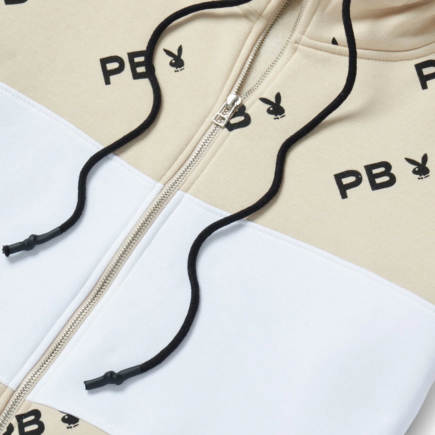 Beige and white women's color block zip sweatshirt with black drawstrings and bunny logo print