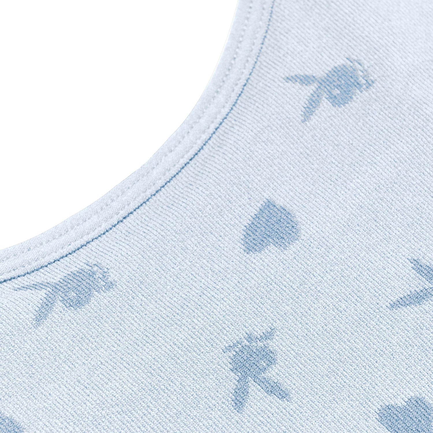 Closeup of light blue seamless cami with subtle bunny and spade pattern, women's fashion top