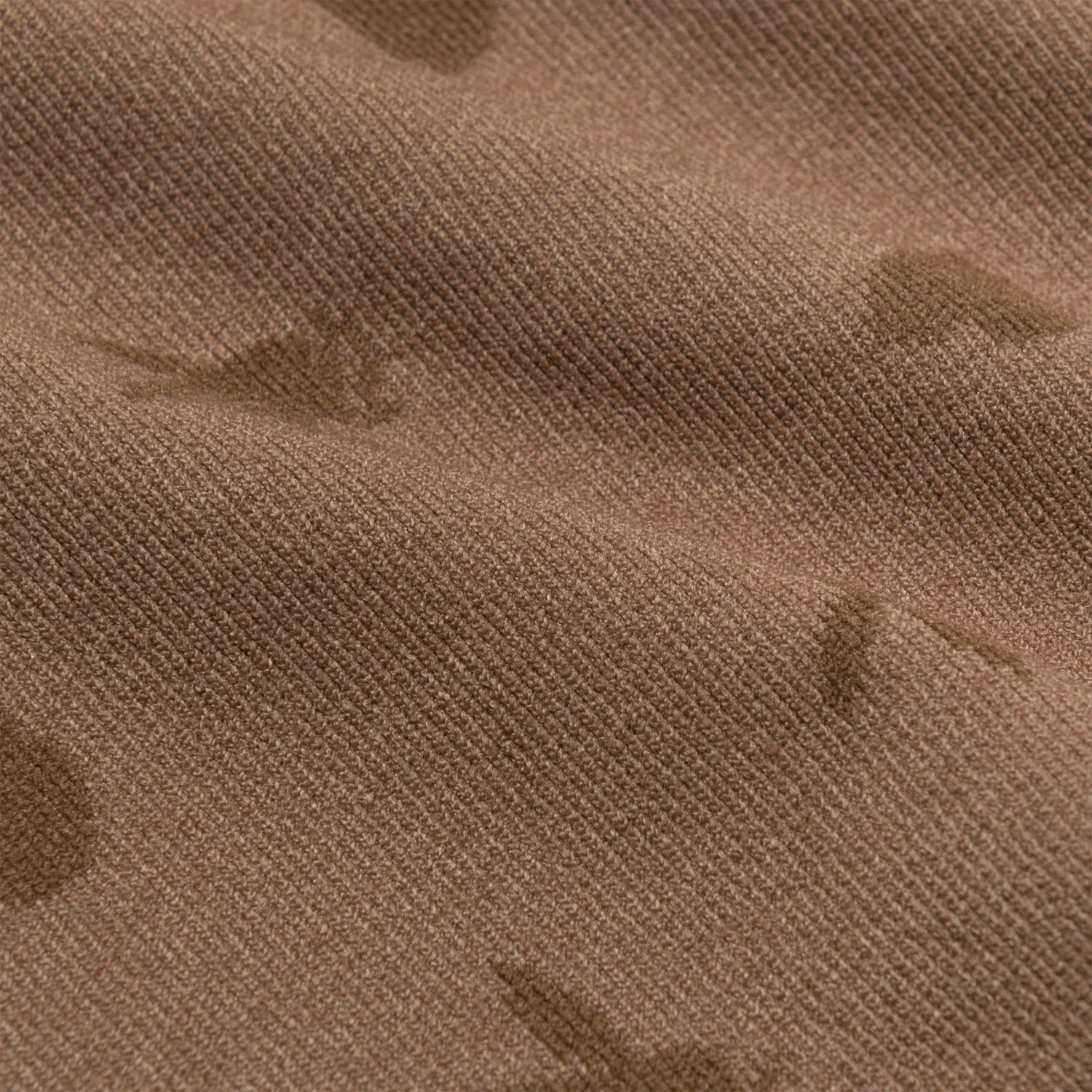 Close-up of seamless brown cami fabric with subtle bunny jacquard texture for women