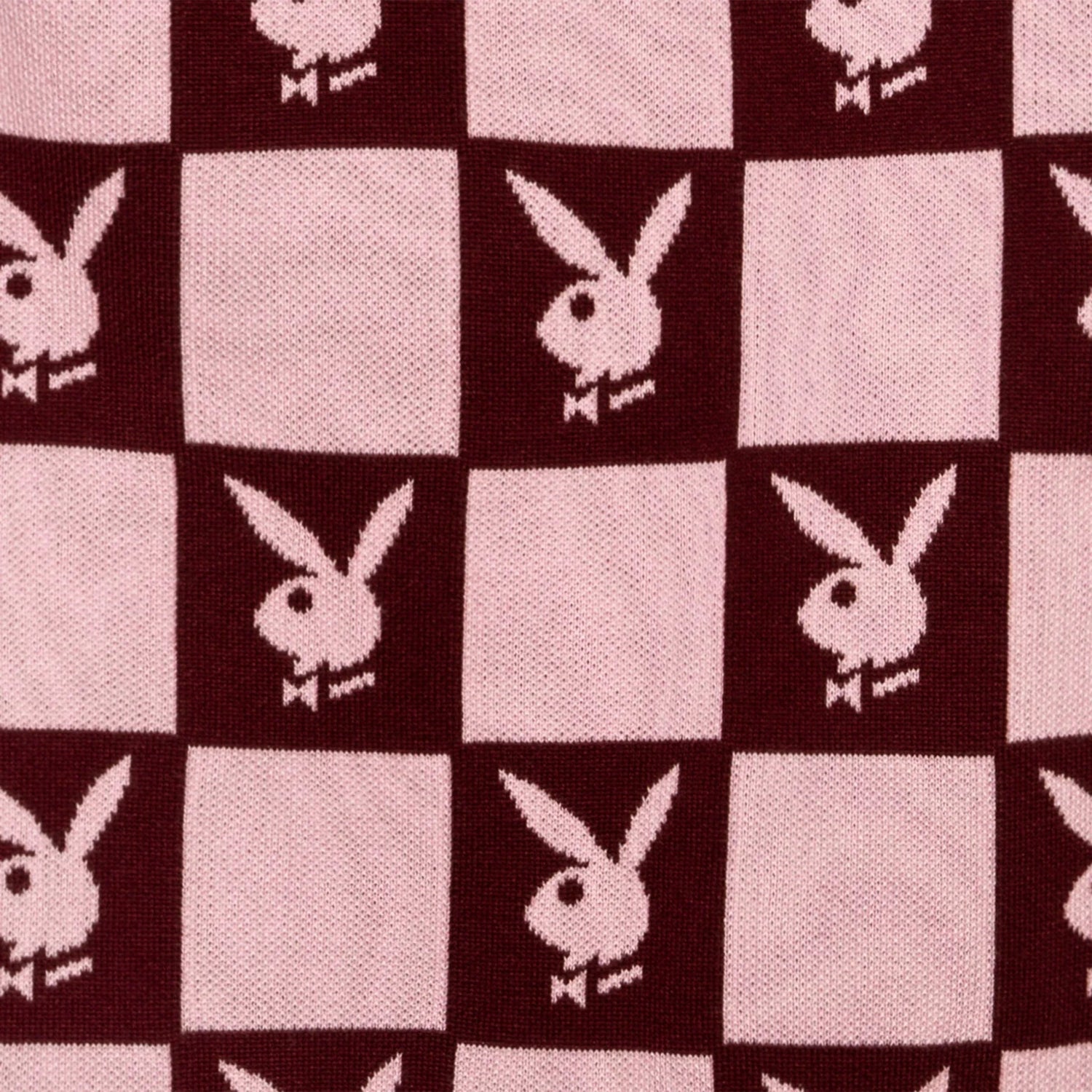 Pink and burgundy checkerboard skirt with repeating rabbit head pattern