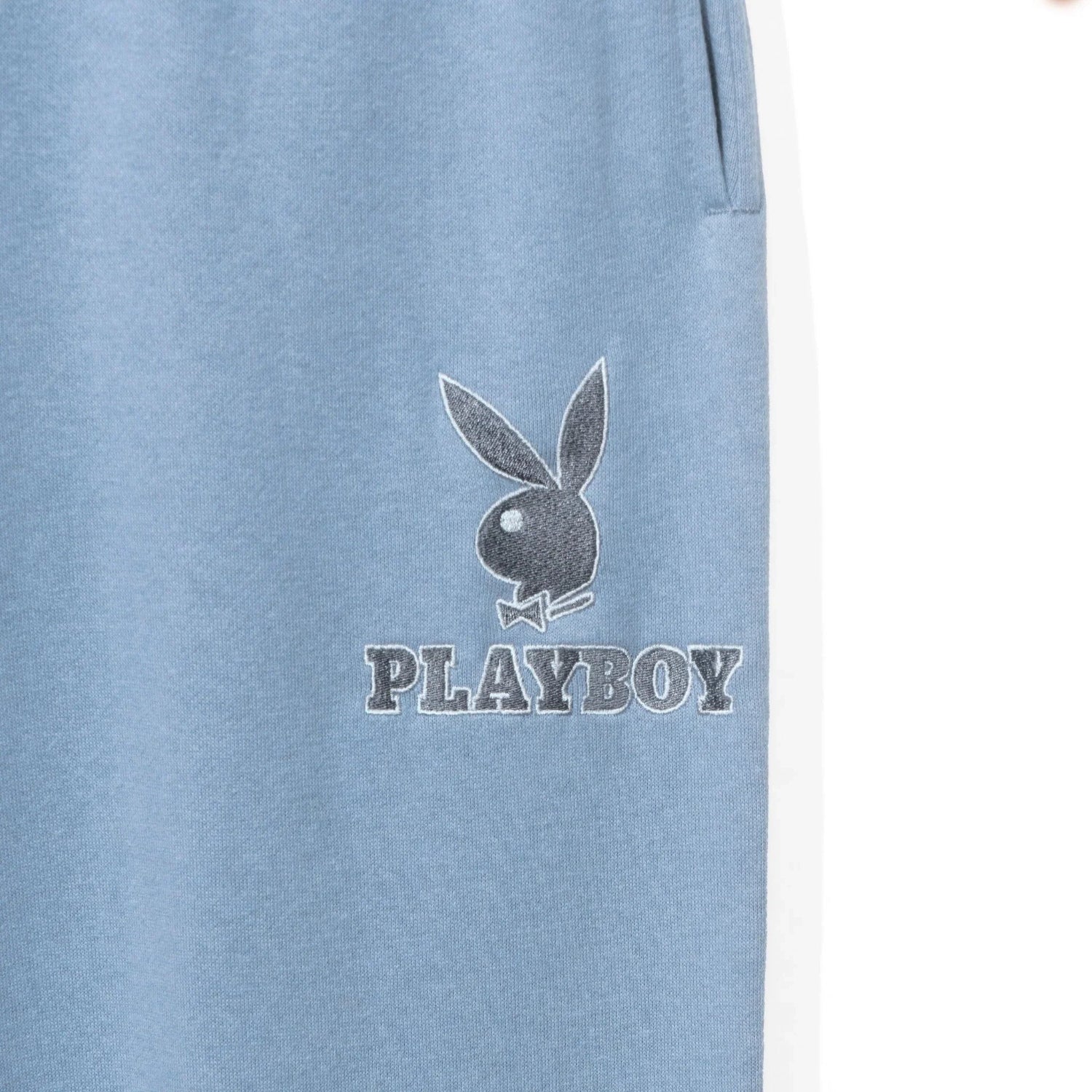 Light blue women's boyfriend sweatpants with pocket and bunny logo text graphic