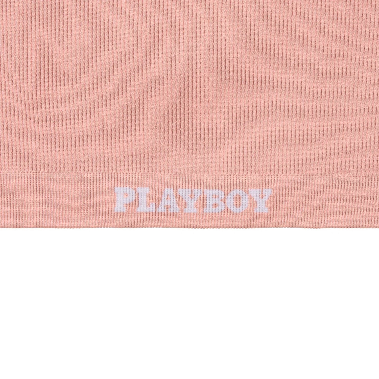 Pink ribbed women's sports bra with logo detail at the elastic band