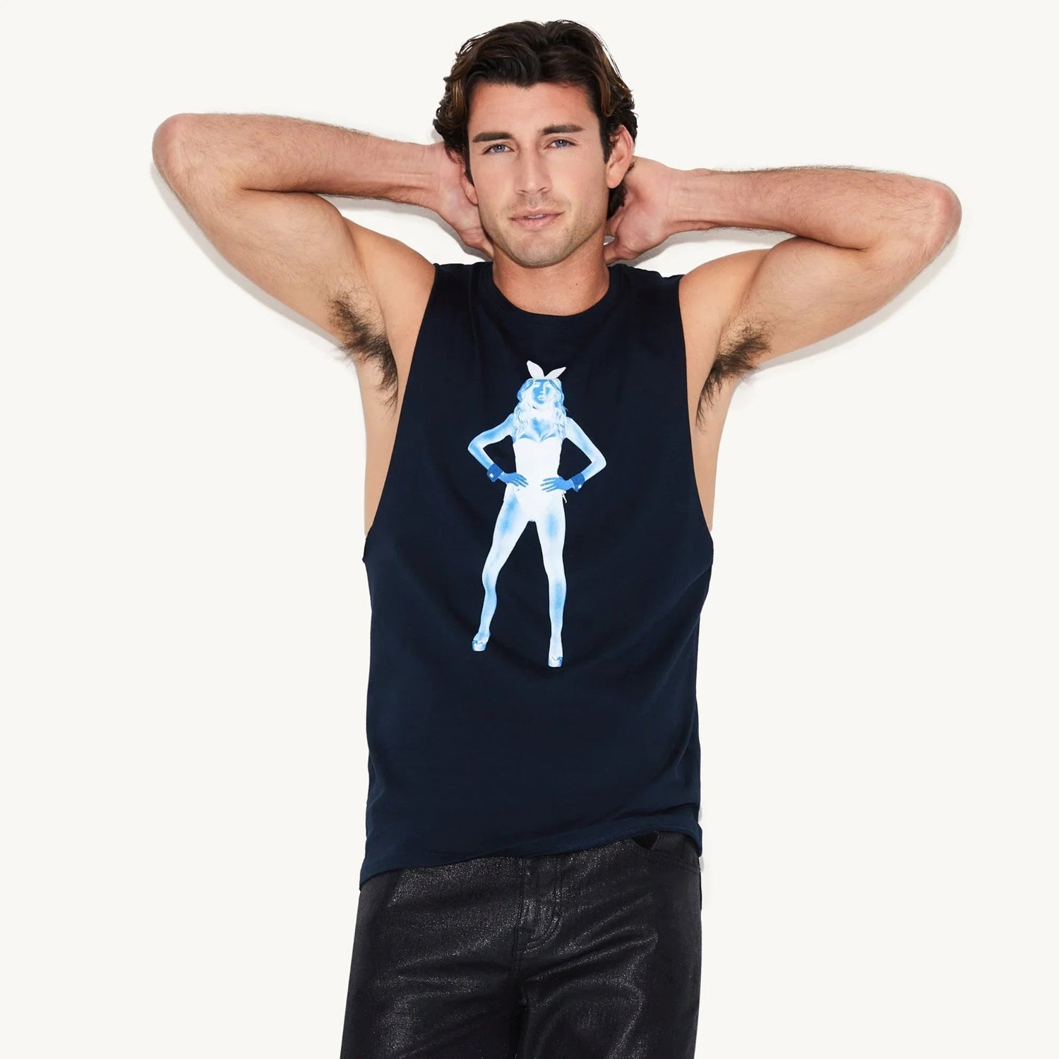 Man wearing black sleeveless tank top with blue X-ray style female graphic on front