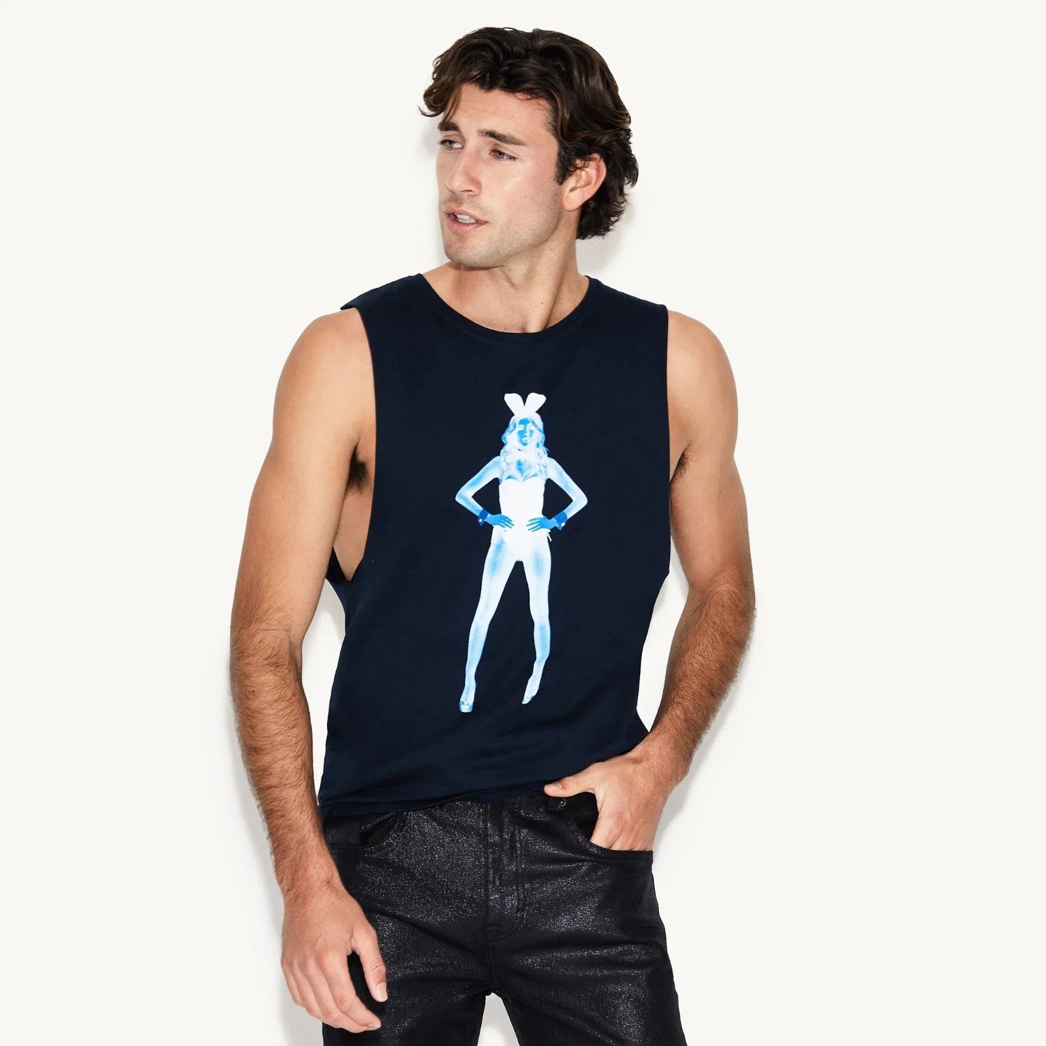 Man wearing black muscle tank top with blue x-ray pinup graphic on front